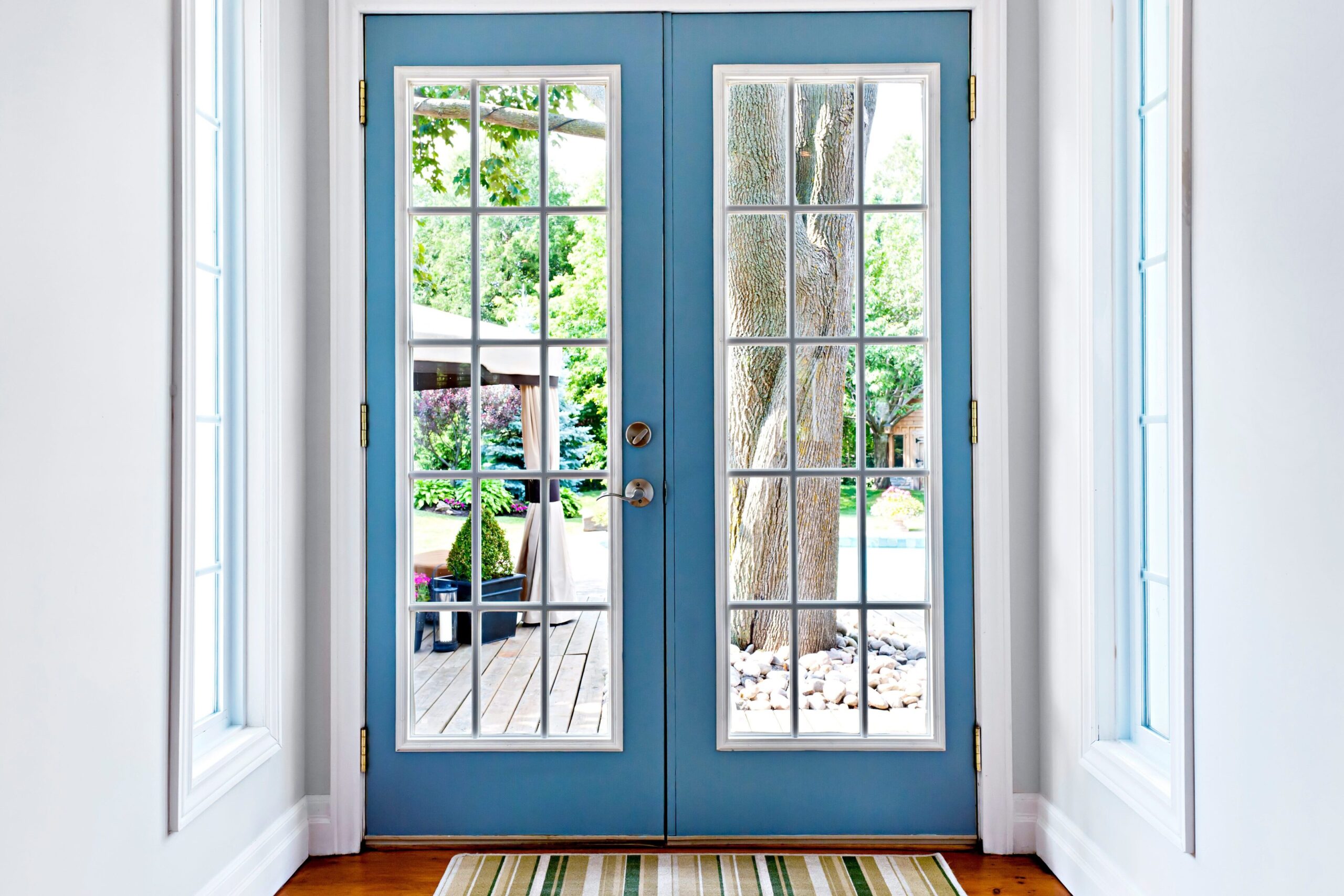 Blue French doors with glass panes.