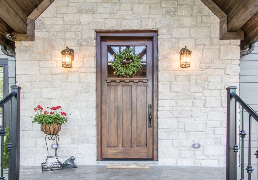 beautiful wooden front door with wreath