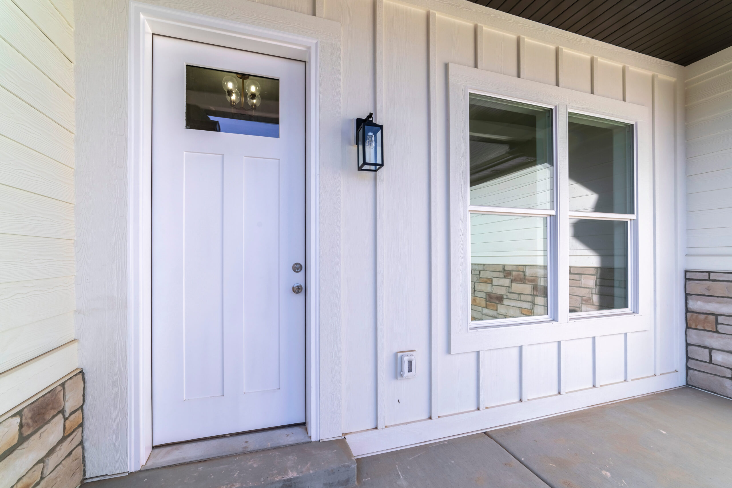 white door on a covered front porch